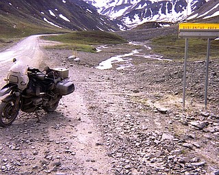 Sharp rocks capable of puncturing tires on the road to Prudhoe Bay. The Road is also spotted with signs warning travelers about possible avalanches.