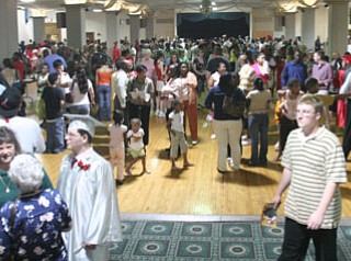 Chaney grads wait out the storm in basement of Stambaugh Auditorium.