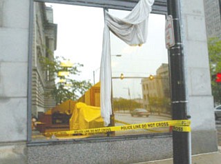 Winds ripped through windows on bank at Wick Avenue and West Boardman Street.