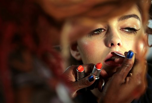Sonia Watson designs the look for model Darla Baker backstage, as she prepares to model the Nanette Lepore 2008 spring collection, during Fashion Week in New York, Monday Sept. 10, 2007. 