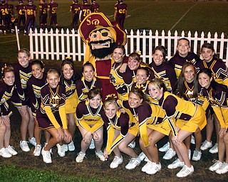 "South Range Cheerleaders hang out with the Raiders mascot."