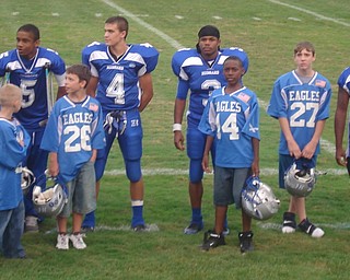 #4 Dave Urey, #3 Andre Taylor, and #5 Kurtis Drummond talking before big
brother/little brother