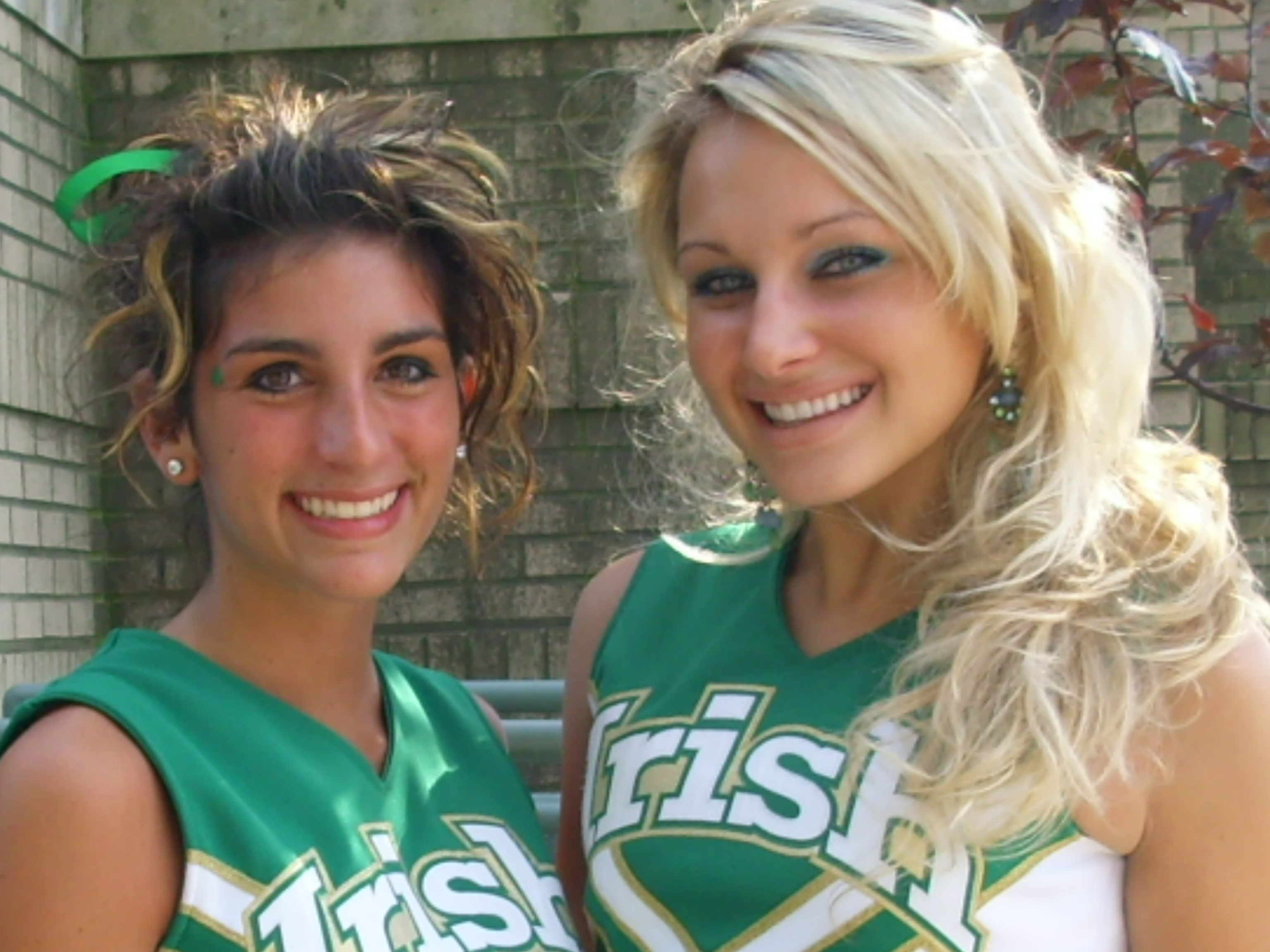 Ursuline Cheerleaders Cara Mia Gatti and Captain Katie Olenick
hit some pre-game poses!