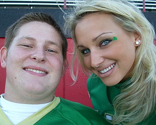"Captain Cheerleader Katie Olenick and Football Player Blake Starcher smile for the Irish!"