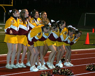 "And we're marching...to the beat...! South Range cheerleaders lead
the band in a favorite cheer.
