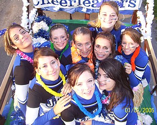 The Jackson-Milton High School Cheerleaders doing the Hula theme on their homecoming float before the football game against Sebring.