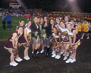 Two South Range Cheerleaders were chosen to represent their classes as Homecoming attendants at the Homecoming game Friday against United Local. Posing with their fellow cheerleaders are Courtney Driscoll, left (in brown) representing the Sophomore class and Christina Oddo, right (in black) representing the Junior class.