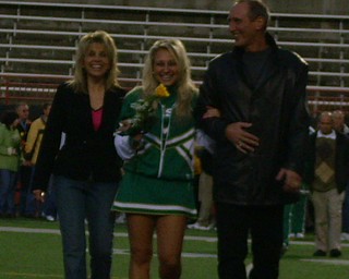 Pictures 409, DSCI0801 - The Olenick Family is full of smiles as they walk their daughter, Cheerleading Captain Katie Olenick, down Stambaugh Field on Ursuline High School's Senior Night!