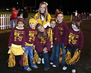 "Varsity Cheerleader Melissa Williams poses with her elementary
cheerleading squad of 2nd graders."