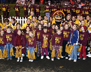 "South Range Raider Man stopped by to pose with some of the elementary
cheerleaders and the high school cheerleaders."