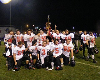 The Canfield Football seniors with the Canfield-Poland Traveling Trophy