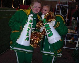 Kayla Spear & Ashley Williams wants to make sure the crowd hears them cheer on the Ursuline Irish so they huse their megaphones.