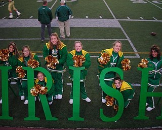Ursuline Cheerleaders show their support to their fans by spelling out I-R-I-S-H.