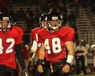 These are pictures taken at Friday nights game against Marion-Franklin on
November 2nd during Canfield's playoff victory. Number 10 is Mark Carrocce
(quarterback) and number 48 is Dan Banna (fullback). GO CANFIELD !!!  YOU
ARE #1  !!!!!