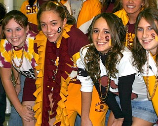 "Ashely Vaughn, wearing the scarf, wins the other "lunch-time spirit
walk-off" and is surrounded by well-wishers."