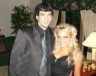 Cheerleading Captain Katie Olenick with her date, Jake Detec, before Ursuline's Varsity Dance