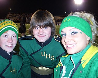 Cheerleader Katie Olenick poses with two students from the band, William Wanio and Jonathan Tomko