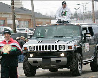 3.16.2008
The Grand Marshall, Kelly “the Ghost” Pavlik, greets onlookers from the sunroof of a hummer during The 30th Annual Mahoning Valley St. Patrick’s Day Parade in Boardman.

