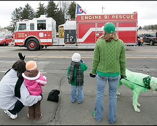 3.16.2008
Onlookers wave as a fire truck passes during The 30th Annual Mahoning Valley St. Patrick’s Day Parade in Boardman.

