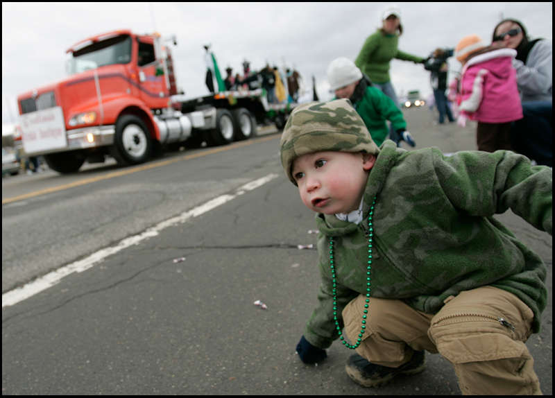 3.16.2008
Conner Wills (2), of Canfield picks up candy thrown by the participants of The 30th Annual Mahoning Valley St. Patrick’s Day Parade in Boardman.