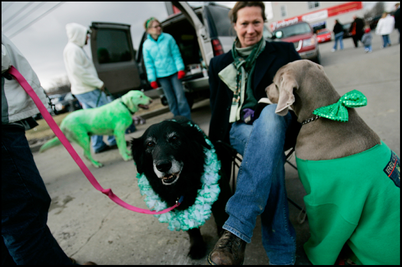 3.16.2008
Susan Fithian, of Berlin Center, sits with Bo (black dog) and Max (brown dog) during The 30th Annual Mahoning Valley St. Patrick’s Day Parade in Boardman.