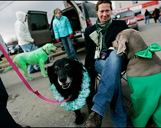 3.16.2008
Susan Fithian, of Berlin Center, sits with Bo (black dog) and Max (brown dog) during The 30th Annual Mahoning Valley St. Patrick’s Day Parade in Boardman.