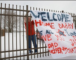 3.22.2008
Family and friends show their support for 23 marines, returning from a seven month deployment in Iraq, at the Youngstown Air Reserve Station in Vienna.
