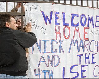 3.22.2008
Ken Timmings (left), of Boardman, and Raymond Marchese (right), of Niles, show their support for 23 marines, returning from a seven month deployment in Iraq, at the Youngstown Air Reserve Station in Vienna. Marchese awaits his son, Nick Marchese's return, Timmings is Nick's uncle.
