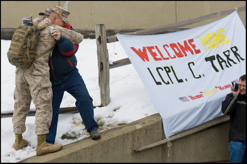 3.22.2008
David Dawson, of Chardon, hugs LCPL Chris Tarr as he returns to the Youngstown Air Reserve Station in Vienna Saturday afternoon following a seven month deployment in Iraq.
