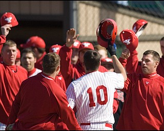 4.2.2008
YSU's Cory Hornyak (10) is congratulated by his teamates after hitting his second homerun in two consecutive games over two days as the Penguins Duquesne Dukes met the Penguins Wednesday afternoon at Cene Park in Struthers.