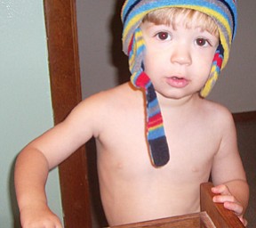 Braden Butler, 2 1/2, in his favorite hat, looking for mischief. Son of Brian and Susan Butler.