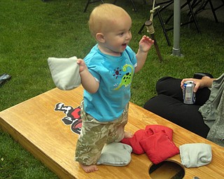 BABY DOM GOT GAME: Dominic Zitello , 1, getting in on the Corn Hole Craze. Son of Brent and Lisa Zitello of Austintown. Submitted by Grandma Dottie Zitello.