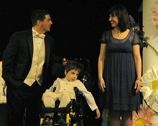Kids and local celebrities model at the Angels of Easter Seals Spring Fashion Show