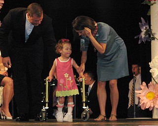 Kids and local celebrities model at the Angels of Easter Seals Spring Fashion Show