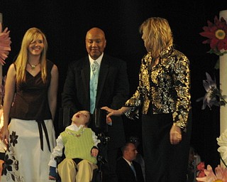 Kids and local celebrities model at the Angels of Easter Seals Spring Fashion Show