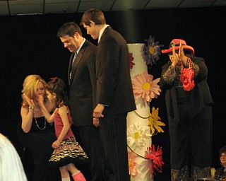 Kids and local celebrities model at the Angels of Easter Seals Spring Fashion Show