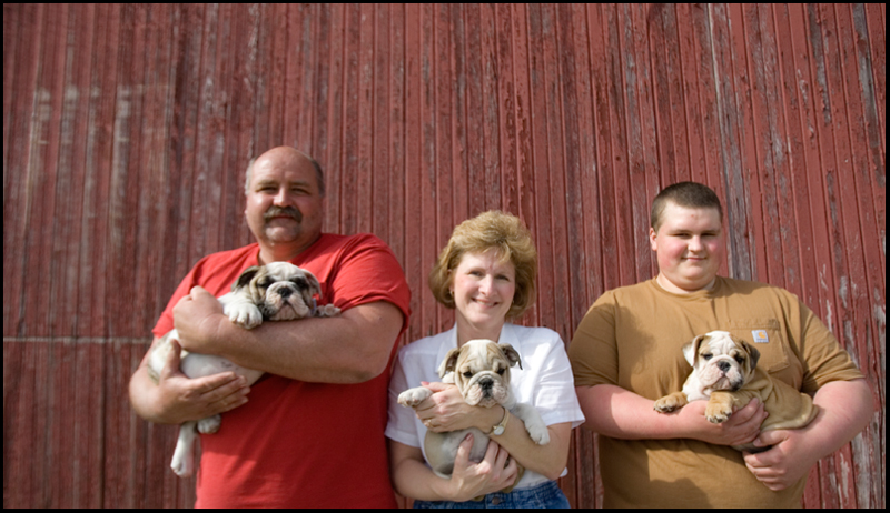 4.24.2008
Jim, Pam, and Eric Evans hold bulldogs outside their barn near their home, Evans Kennels, in Berlin Center, Thursday afternoon. In addition to operating the kennel, the family breeds English Bulldogs.
