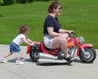 Jill Moran's daughter, Madelyn, 3, gives mom a push.