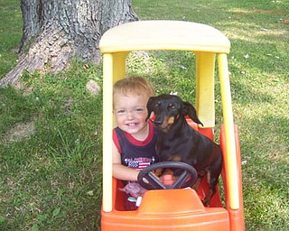 Shelley Derrow's son, Tommy, enjoys a "drive" with Peanut.