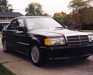 This is Monica Skurich's (from Poland, Ohio) 1987 Mercedes Benz 190E
2.3-16V.
It is a modern era classic, with less than 2000 made, it was Mercedes way
to showcase technology and racing/rallying ability in a special high
performance model.
The heart is a Cosworth racing derived engine that allowed the car to set
several world records for speed and endurance in Nardo Italy. But the car
also had all the latest and best luxury and conveniences that Mercedes had
available.
They are sought after today for their low production volumes, uniqueness,
and heritage as these cars are the early predecessors to the current AMG
high performance Mercedes Benz models. ... Provided by her son, Michael.