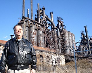 Ron Unger, director of advancement for the nonprofit ArtsQuest in Bethlehem, Pa., stands in front of the Bethlehem Steel plant. The structure will soon be incorporated into an entertainment center.