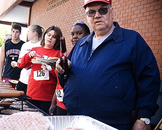 Grill master and YMCA volunteer Van Bates of Youngstown offers up another hot dog -- a gesture Jason Schilling had become all too familiar with.