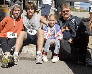 L-R: Linda Rein, Dan Rein, Katie Rein and Karl Rein of Austintown. According to Linda, Katie, who has not yet turned 12, is the family's most sought after and experienced runner. Linda said Katie got local media attention after breezing through the Smokey Hallow race at age 3.