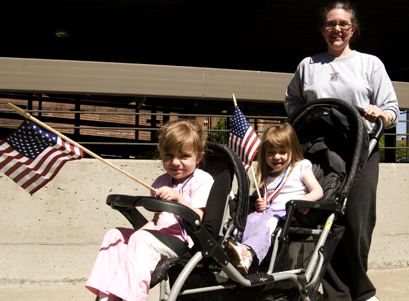 Jenn Quinlan of Boardman pushed daughters Adrianna, 4, left, and Genevieve, 3, the entire five mile with flags that must have decreased aerodynamics. Both girls made it clear that the concept of drag does not bother them. 