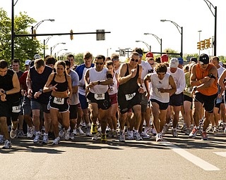 Now in their late 50s, Cindy (#302) and Curt (#303) Grimm started racing in 1983 both qualifying for the Boston marathon several times since. "Running keeps us young," Curt Grimm said, "my wife looks like she's 30."