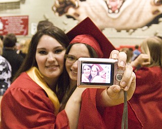 Galioto and Lisa Pesa, right, capture their last moment together in the Struthers field house.