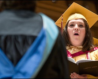 6.1.2008
Jessica R. Sarich sings with her fellow senior choir members during Liberty High School's commencement ceremony Sunday afternoon at Stambaugh Auditorium.