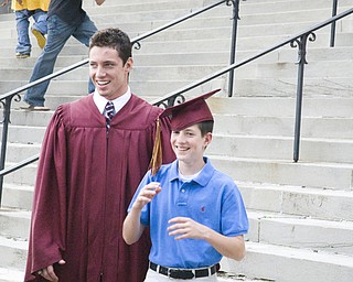Say Cheese: Graduate Daniel McCarthy and Younger brother Michael clown for the camera. Stambaugh auditorium was packed with over a hundred graduates and their families.