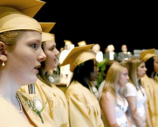 Commencement opened with the school song led by choir students like Amanda Lichty, left.