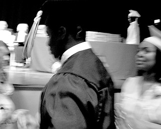 Over 300 graduates donned caps, gowns and forget-me-nots, the 2008 class flower, to take the stage at Packard Music Hall in Warren. This year's class will be the last to complete all four years in the current high school building, which is slated for demolition.